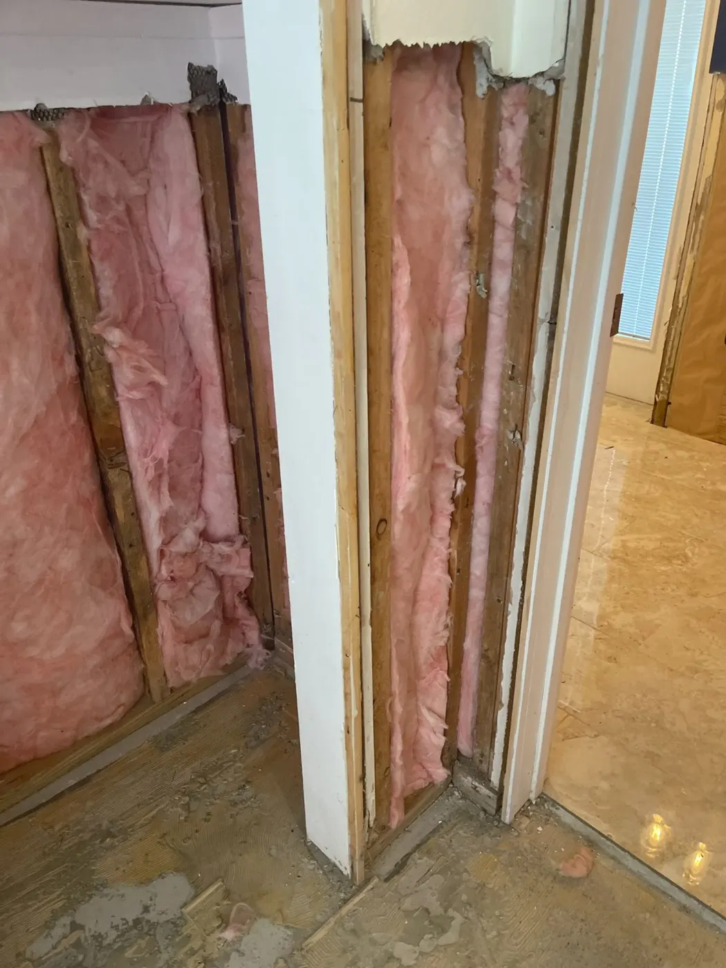 Flood cut along a doorway with wet materials removed